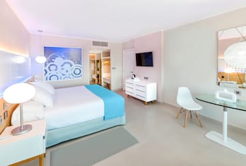 a bedroom with a bed and a table