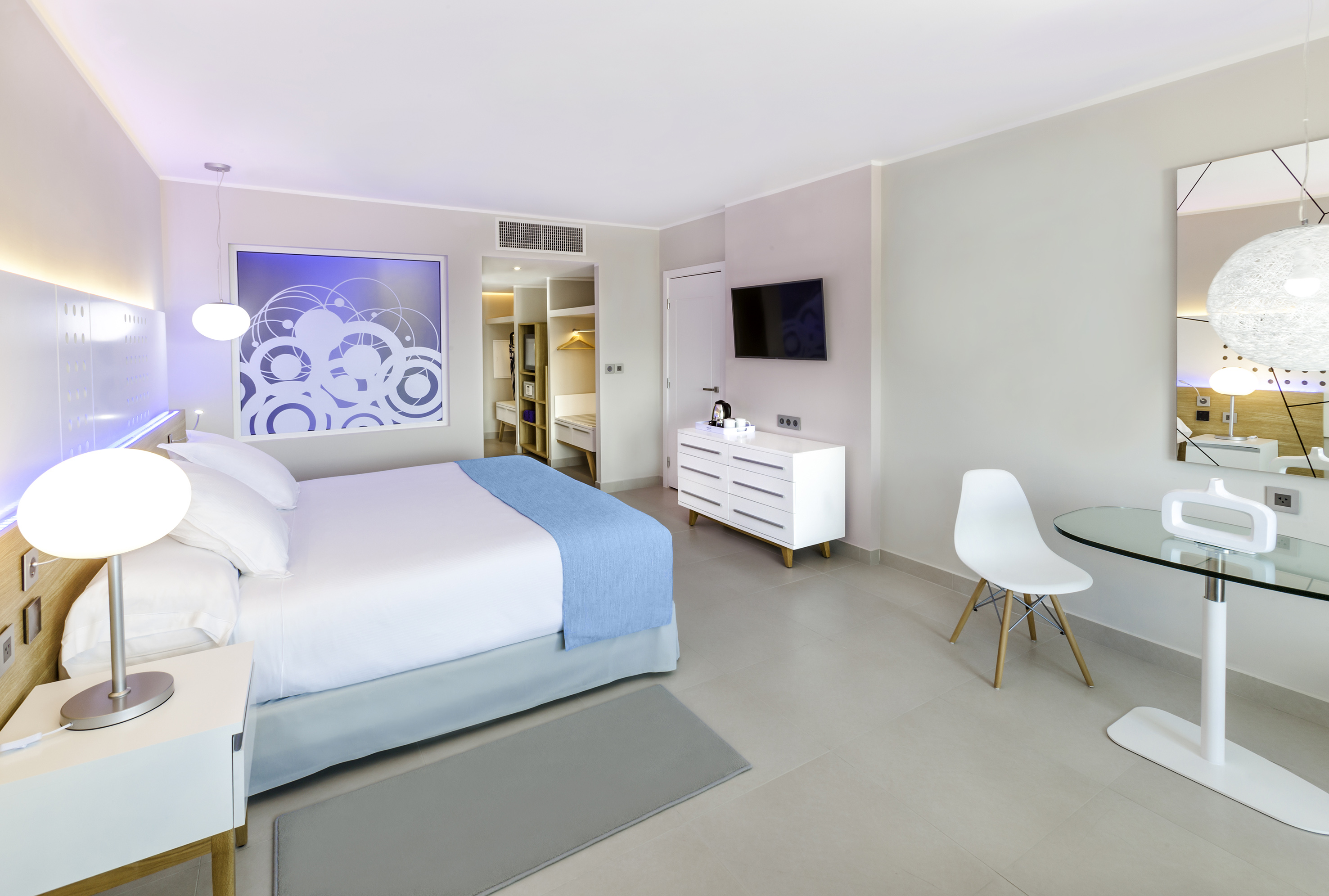 a bedroom with a bed and a table