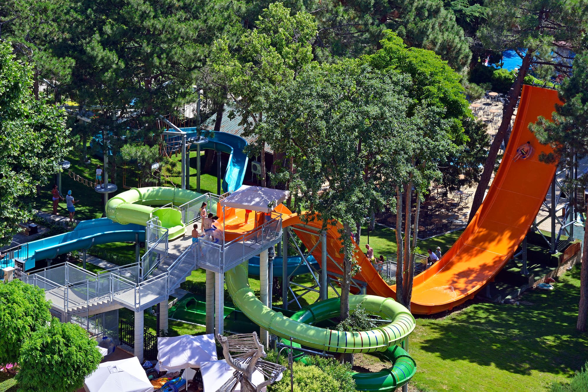 a water park with slides and trees