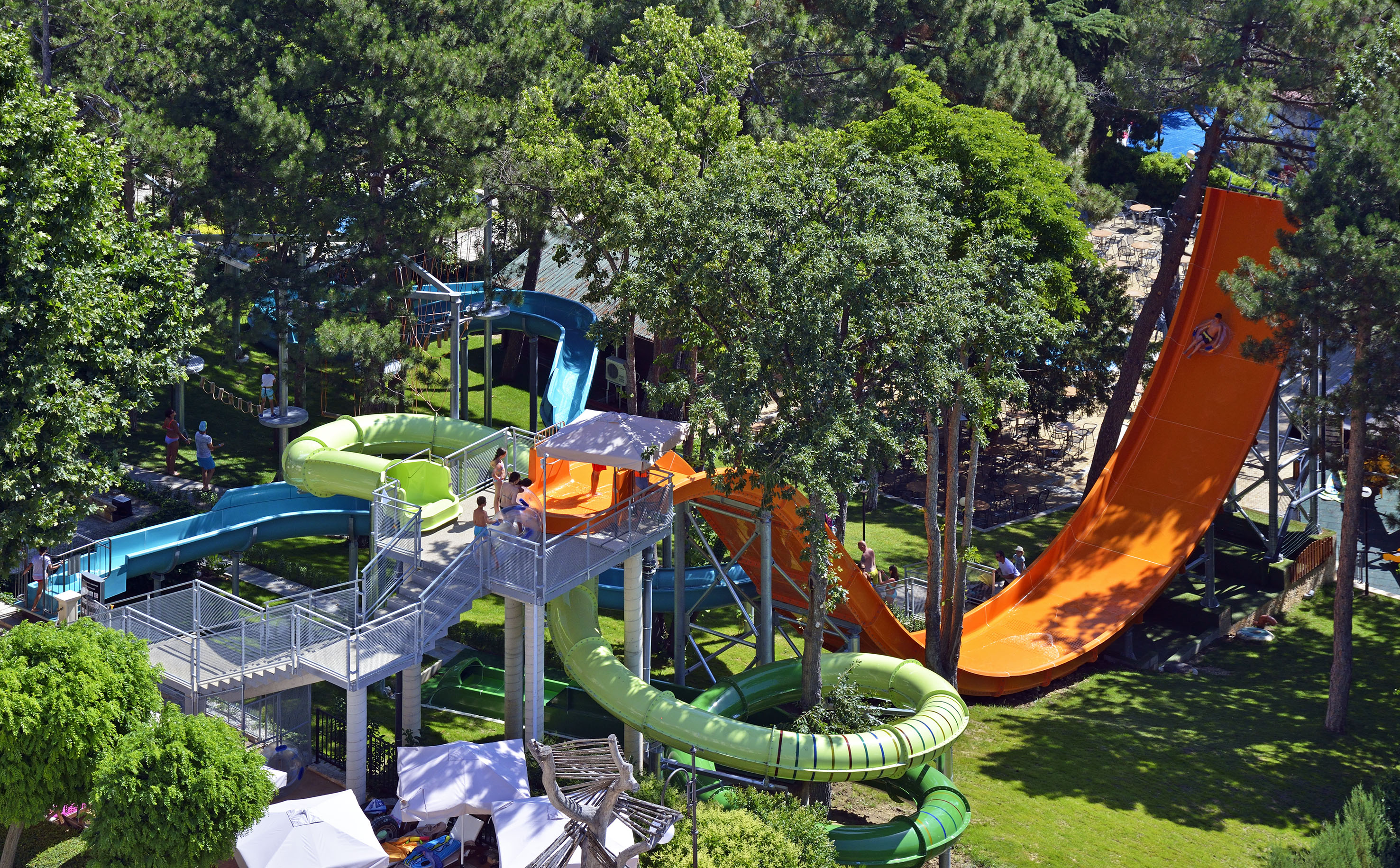 a water park with slides and trees