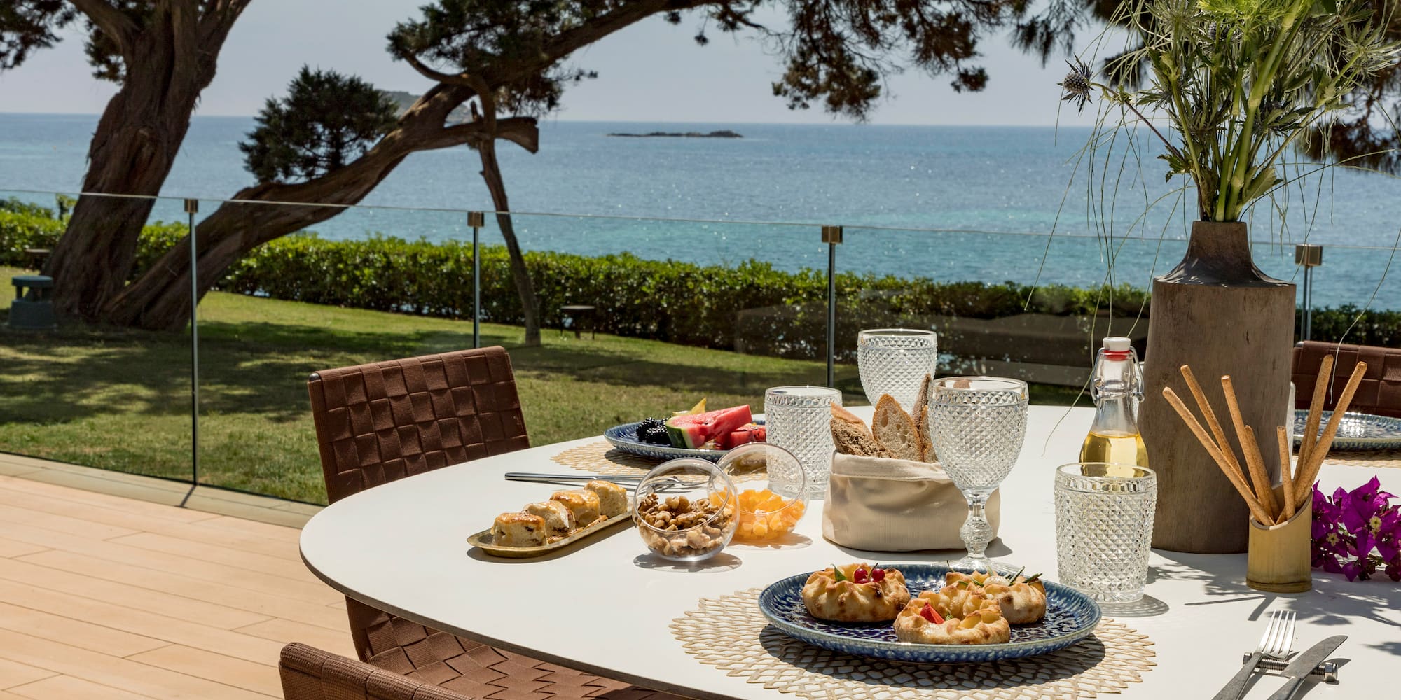 a table with food on it and a glass of wine on it