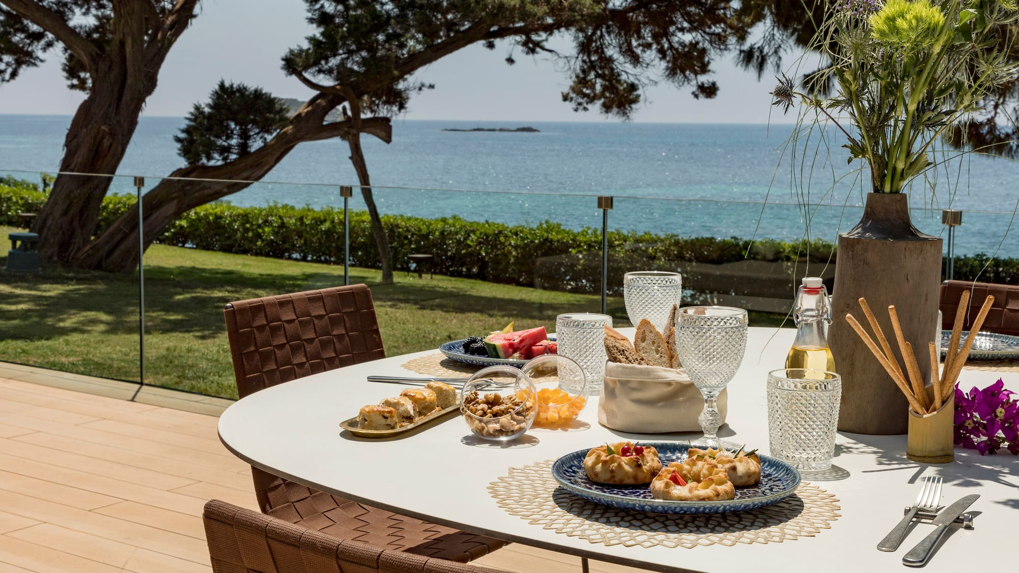 a table with food on it and a glass of wine on it