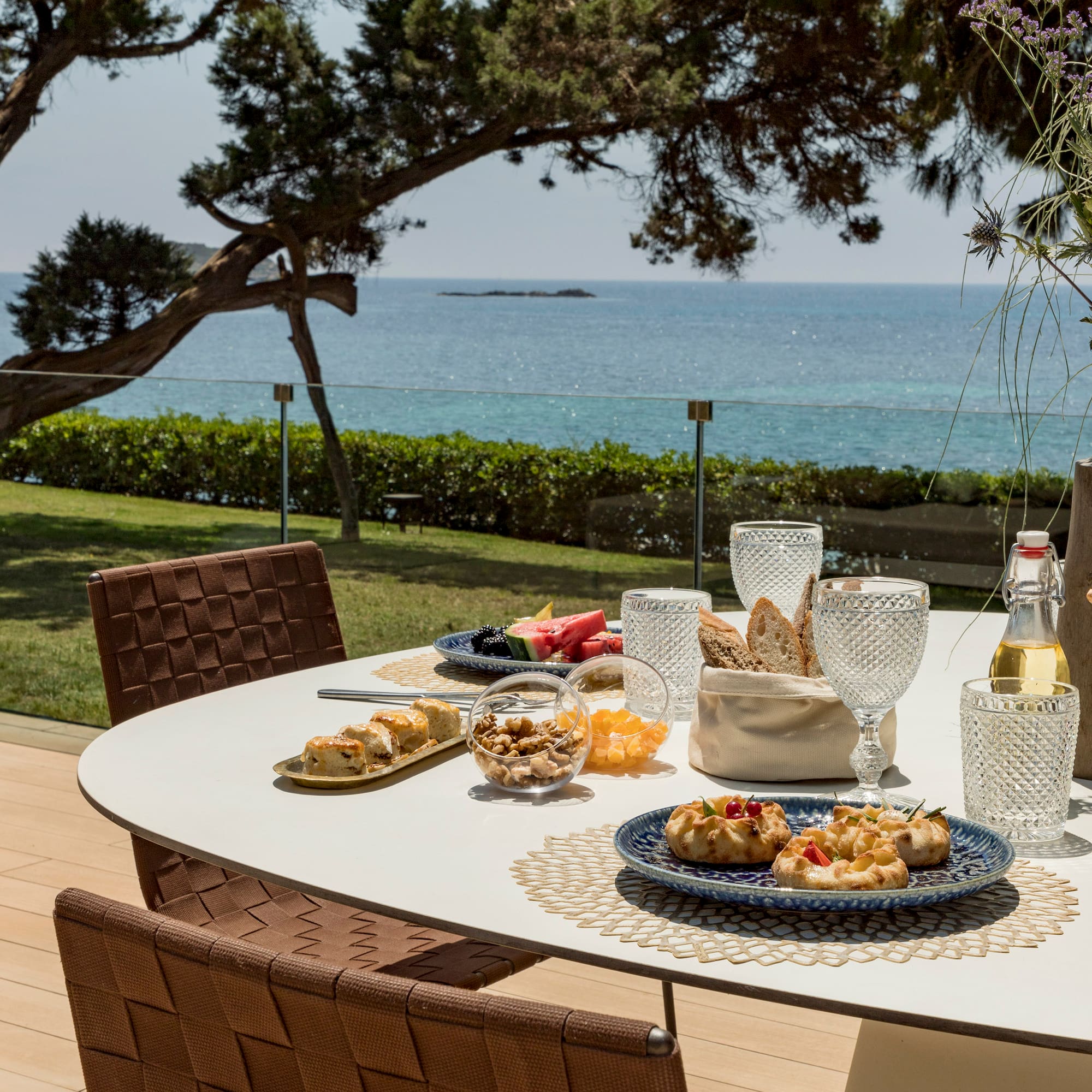 a table with food on it and a glass of wine on it
