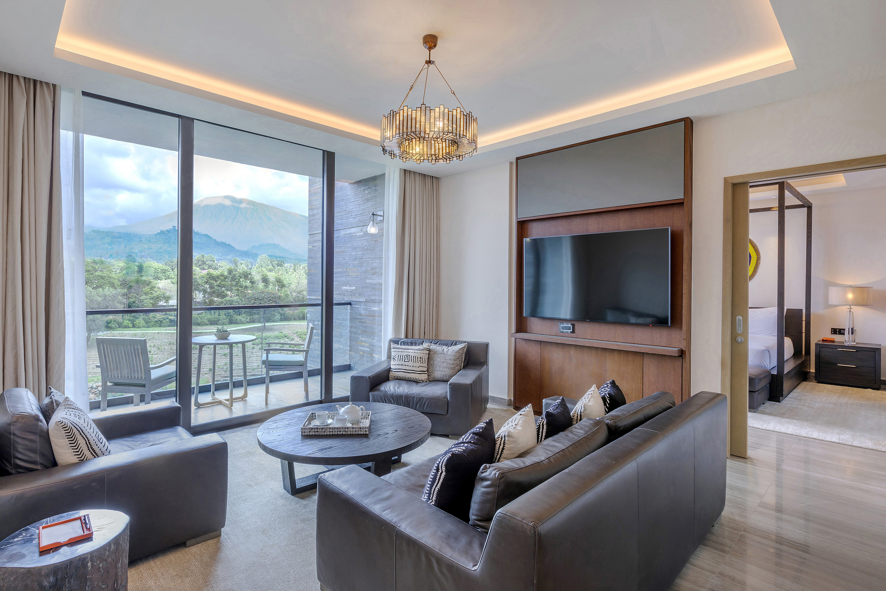 a living room with a television and couches