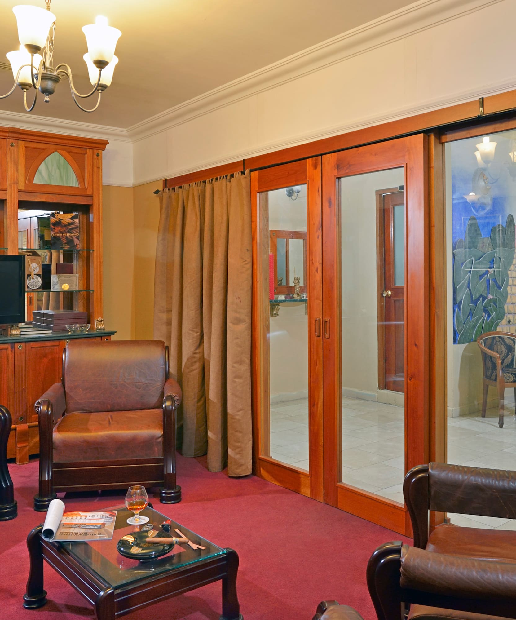 a room with a television and chairs