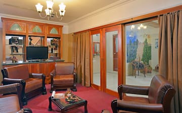 a room with a television and chairs