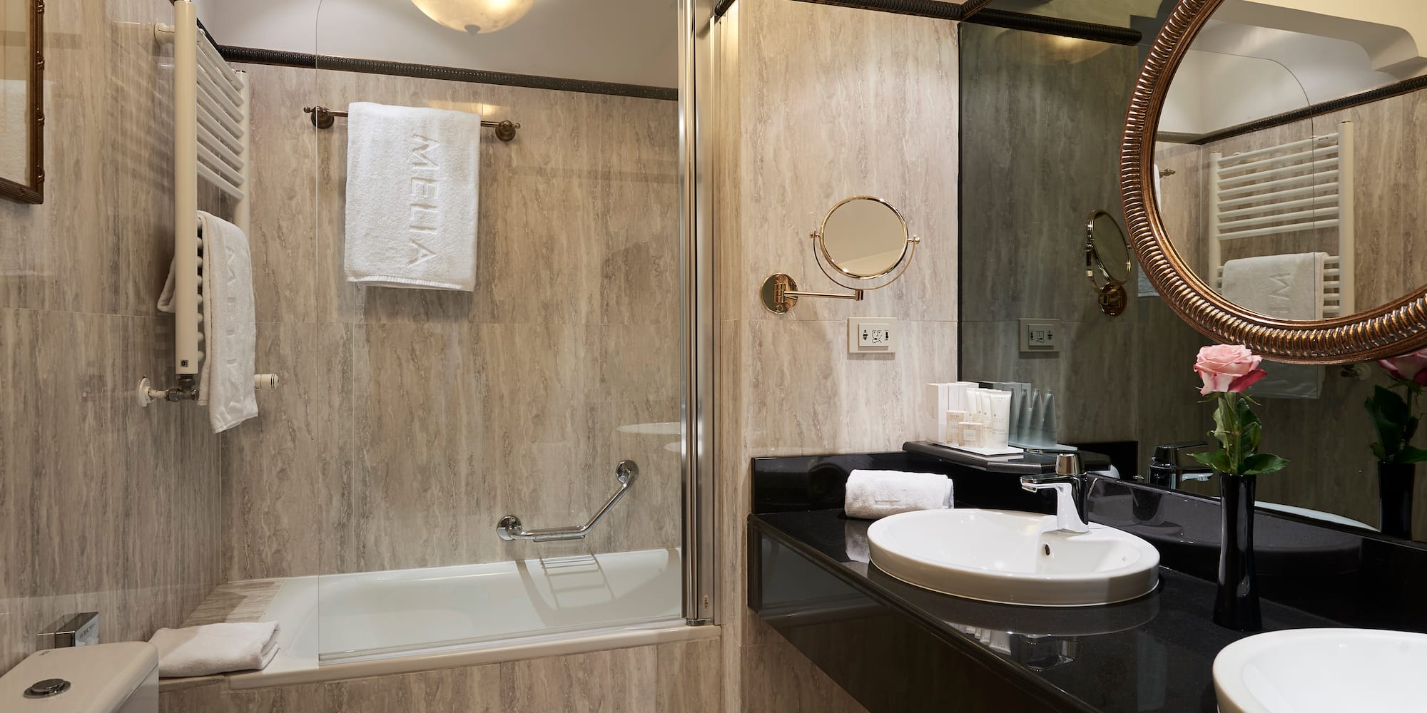 a bathroom with a shower and sink