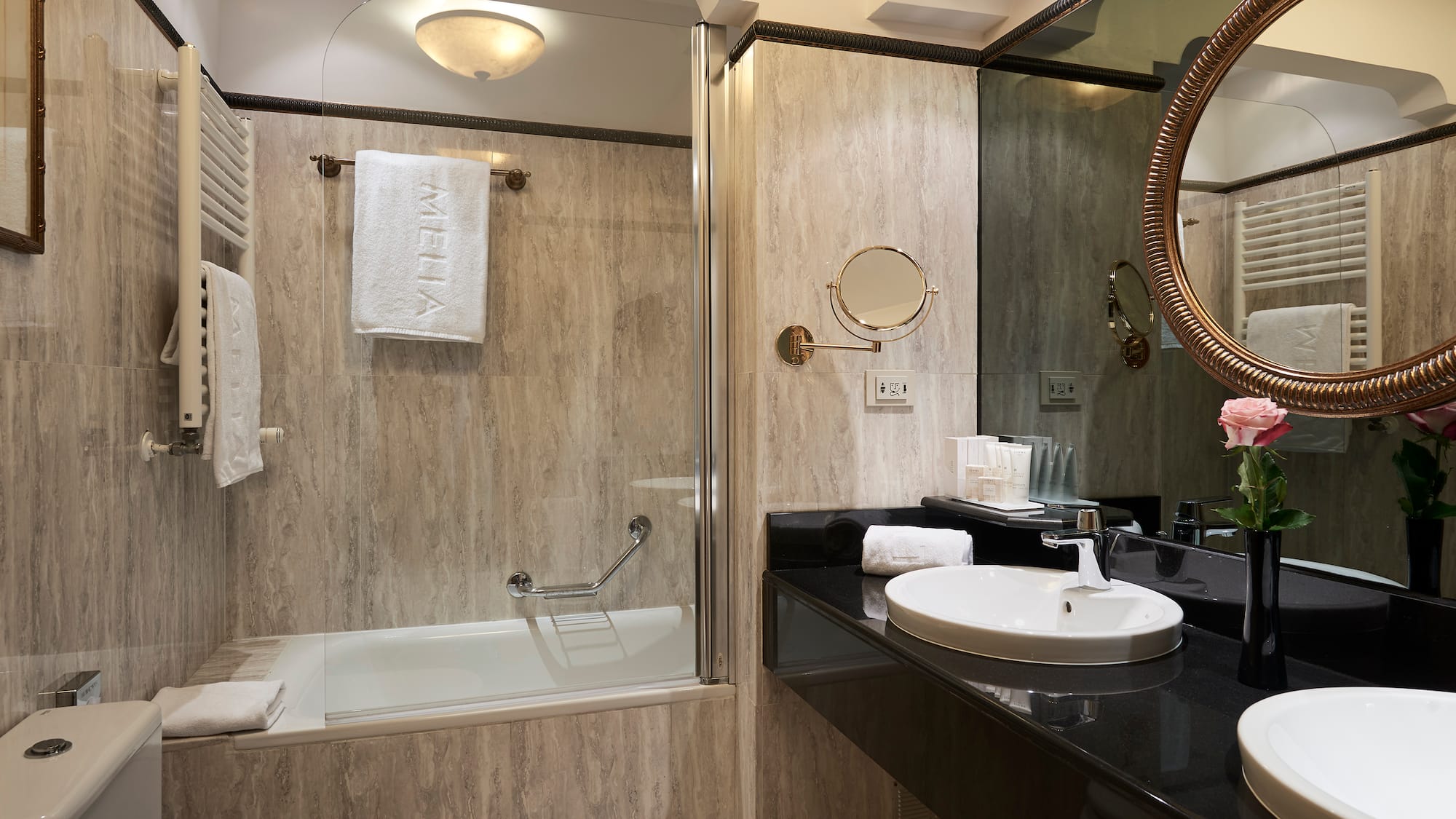 a bathroom with a shower and sink