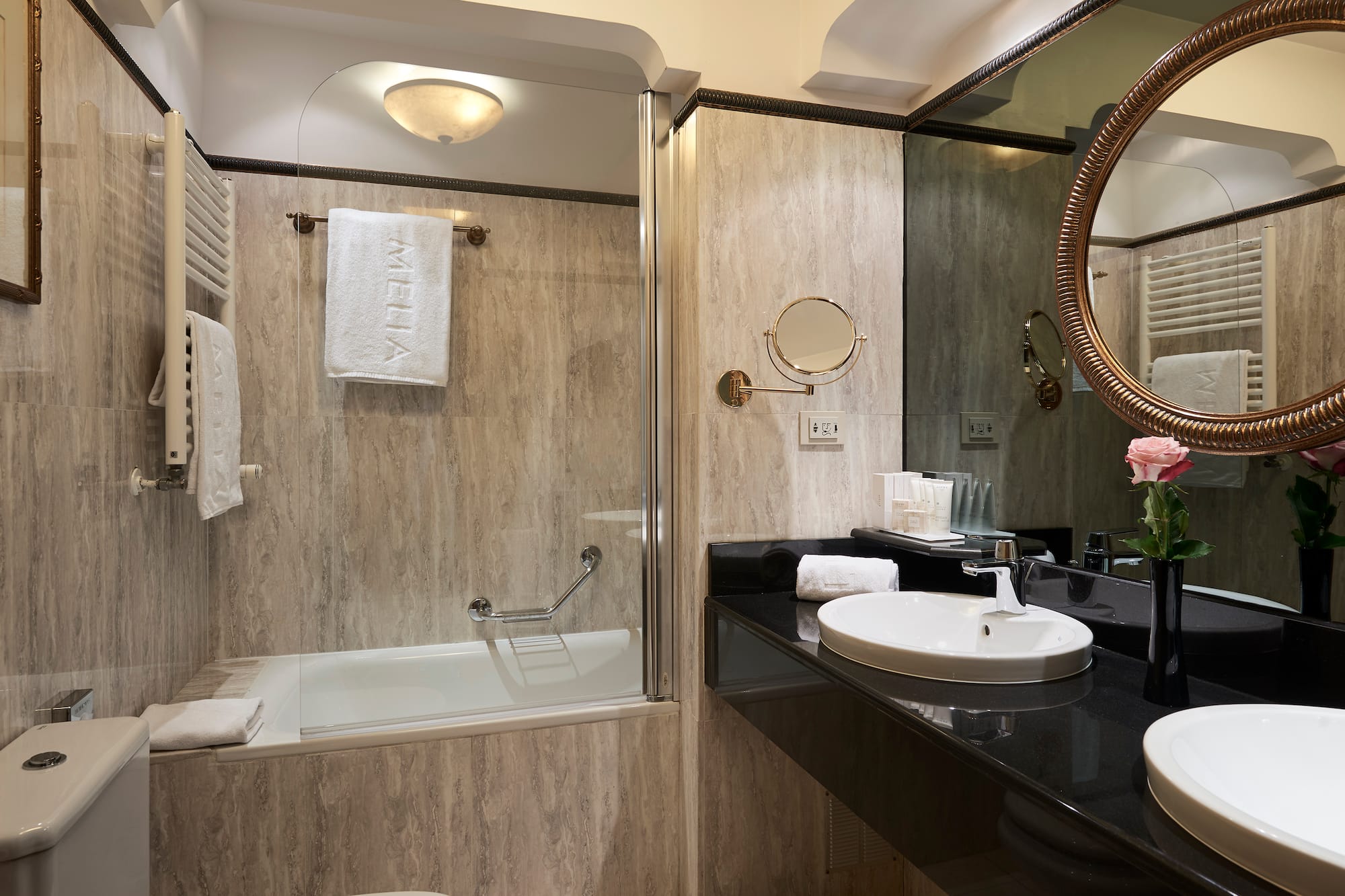 a bathroom with a shower and sink