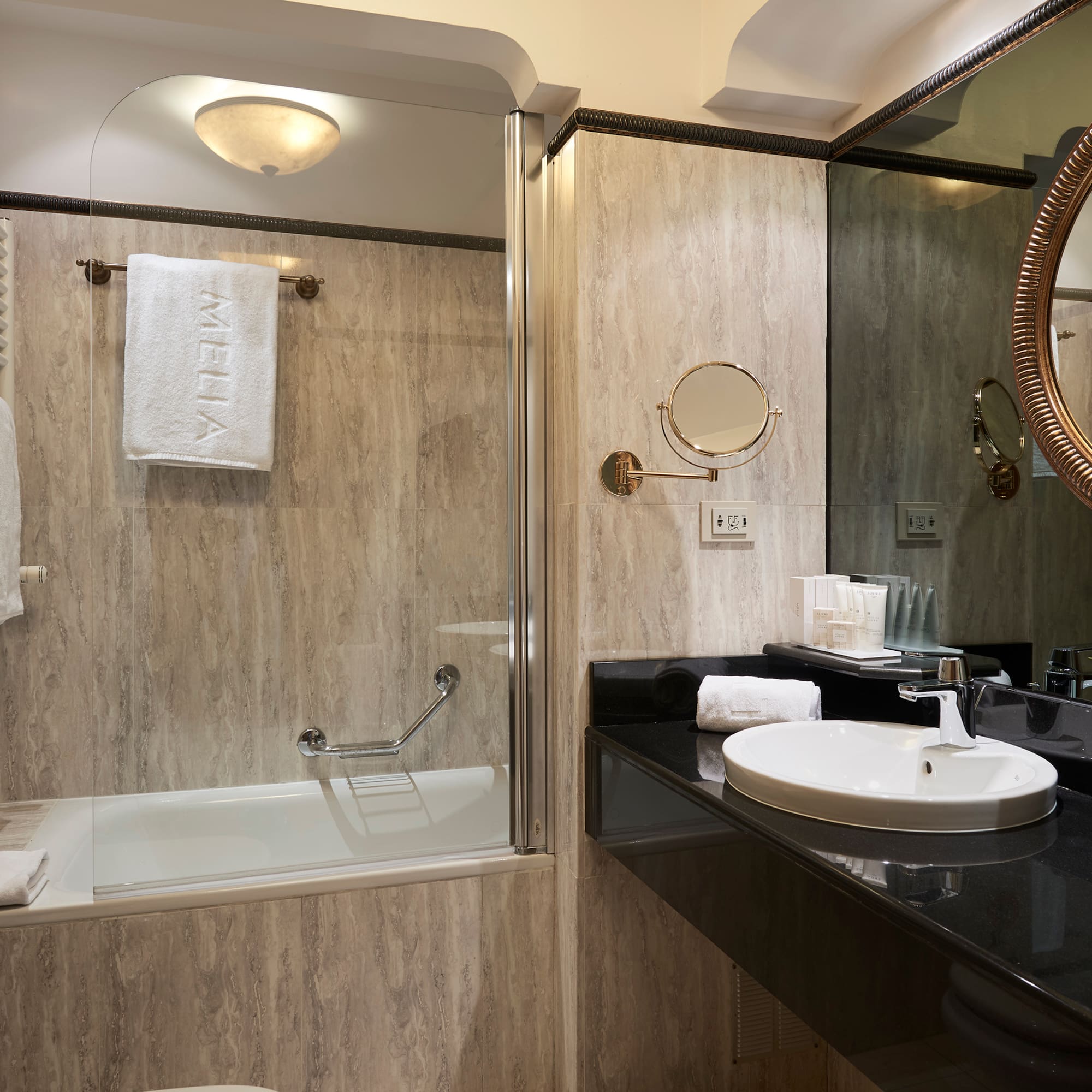 a bathroom with a shower and sink