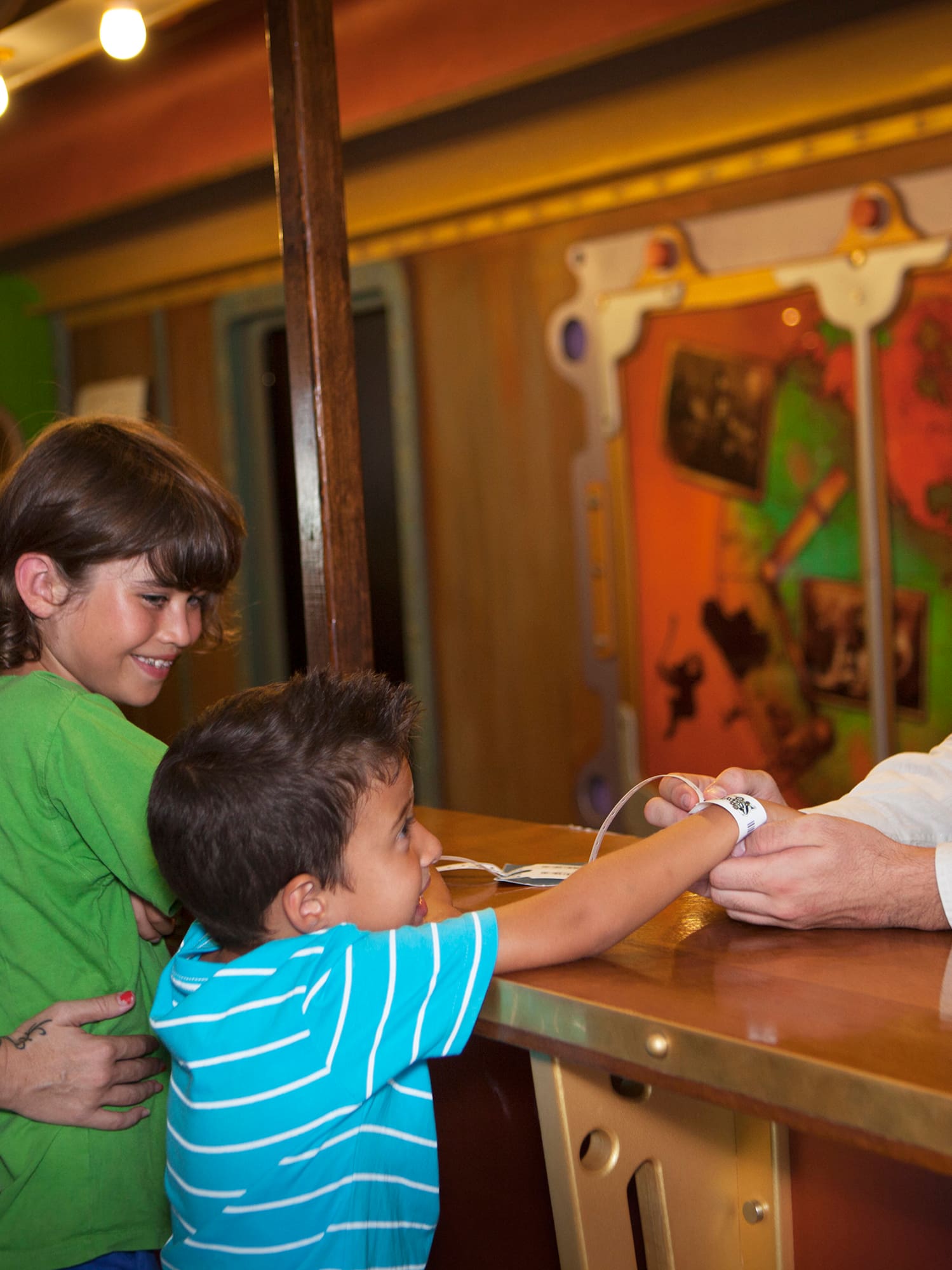 a man and woman standing next to a couple of children