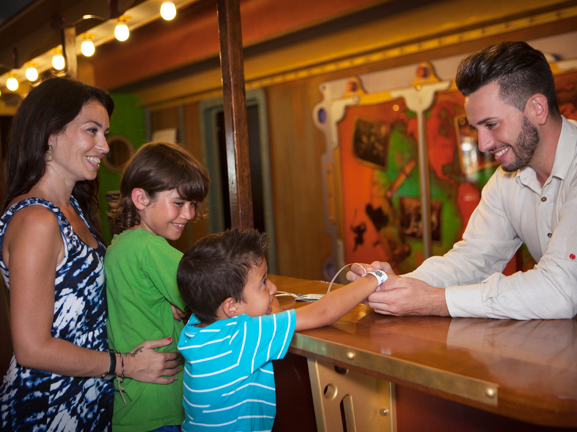 a man and woman standing next to a couple of children