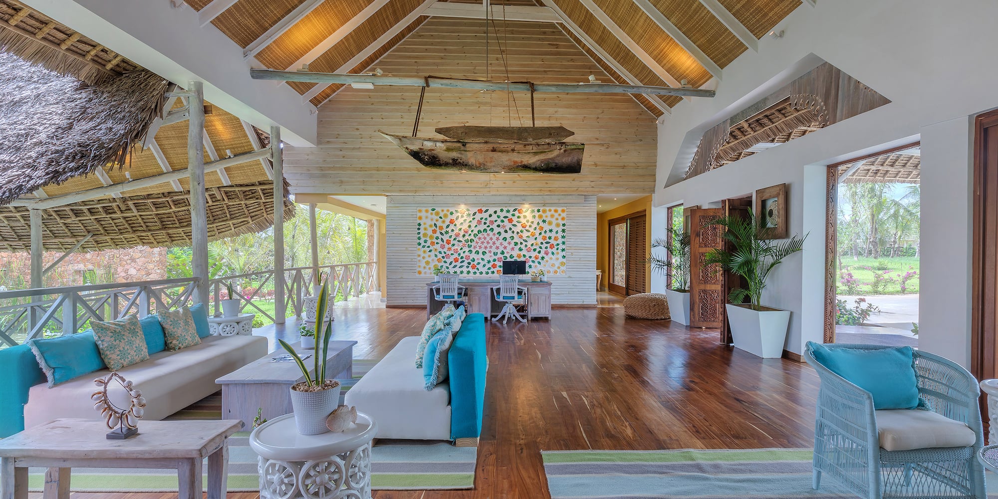 a room with a large ceiling and a large table and chairs
