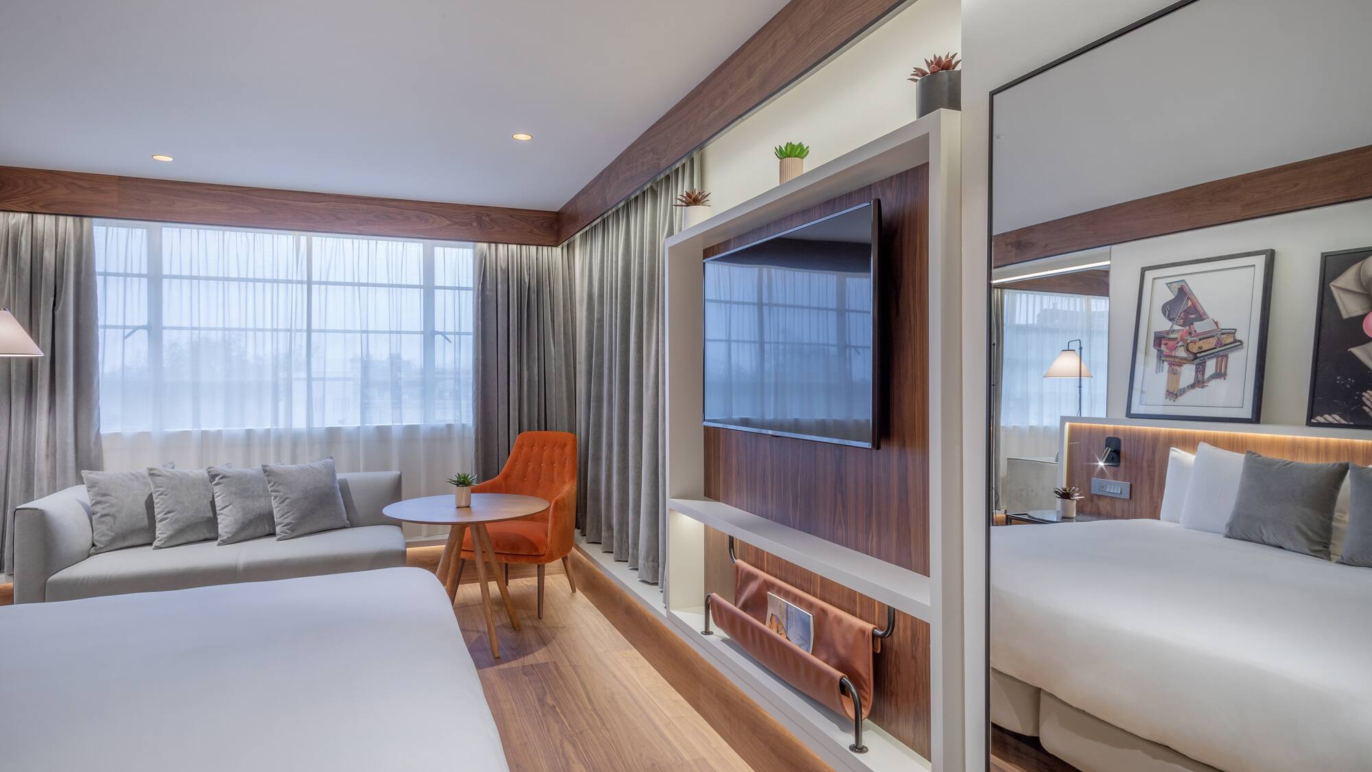 a room with a bed and a tv