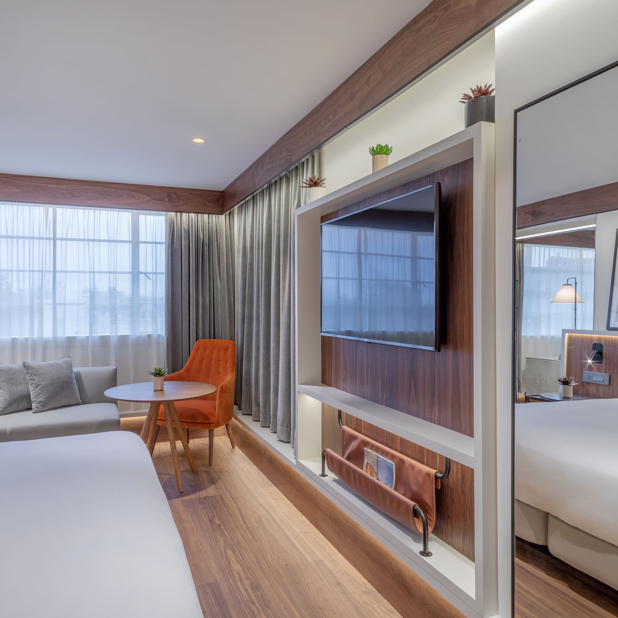 a room with a bed and a tv