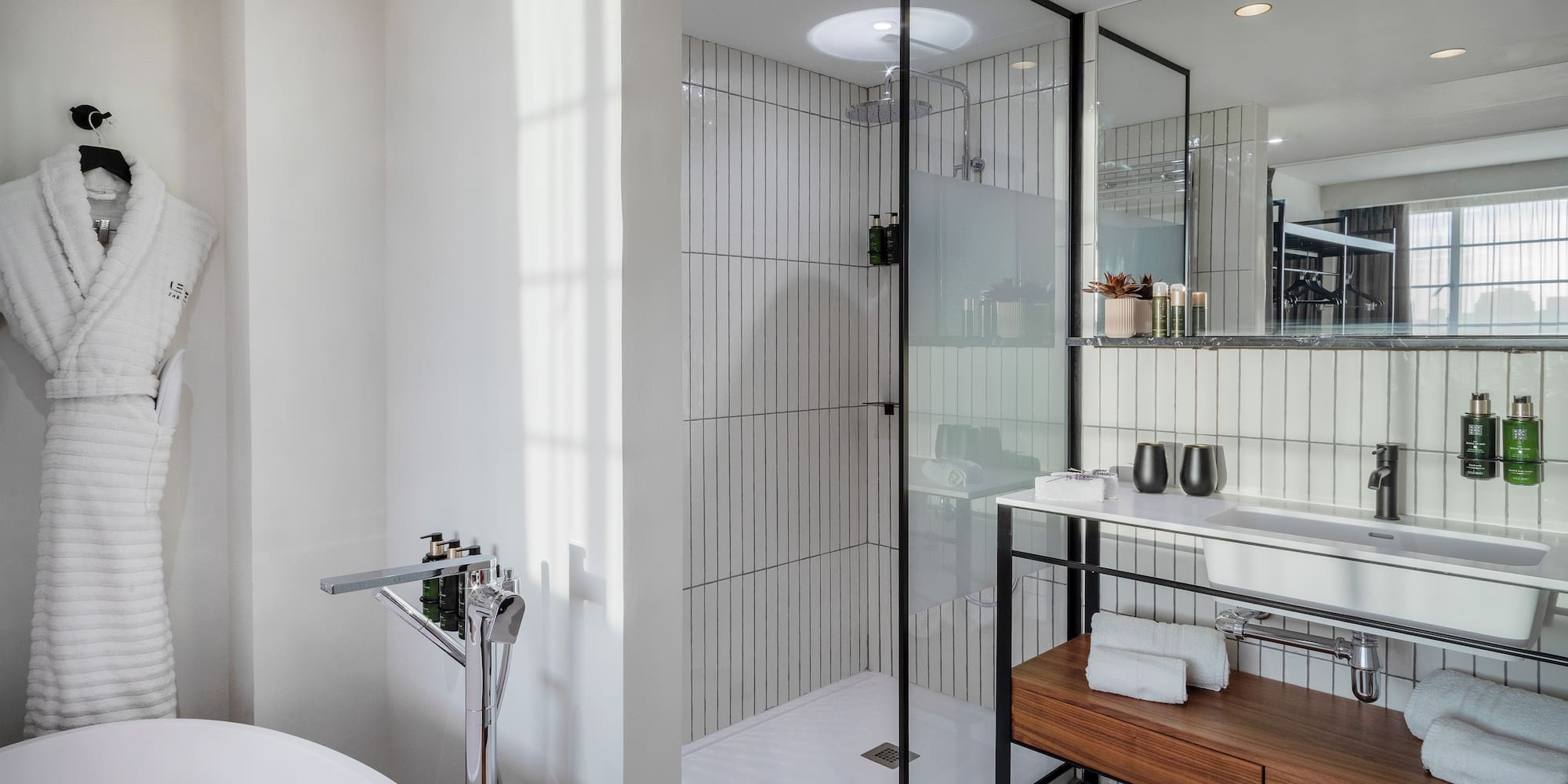 a bathroom with a tub and shower