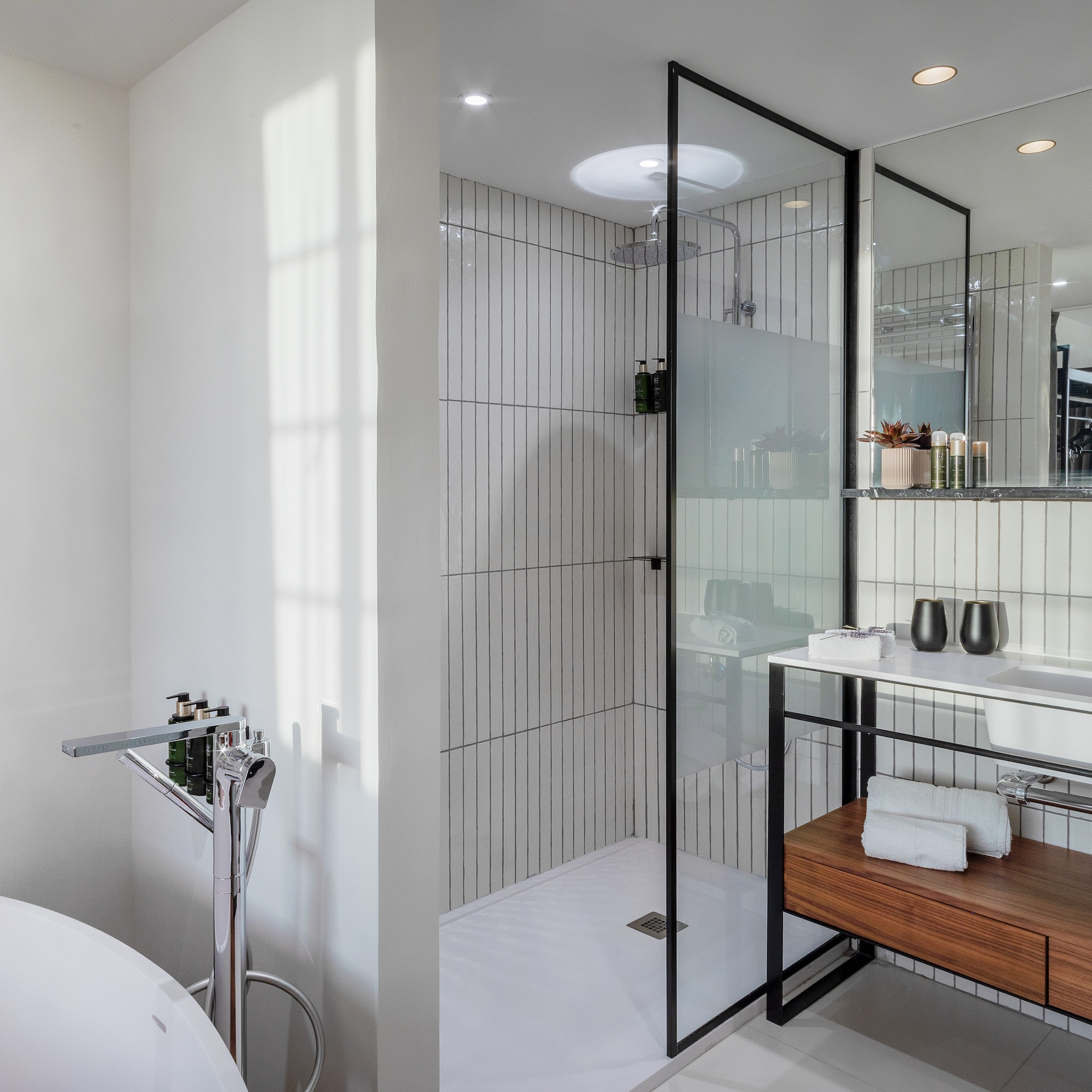 a bathroom with a tub and shower