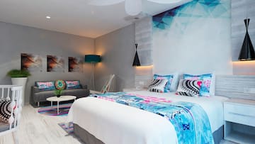 a bedroom with a bed and a couch