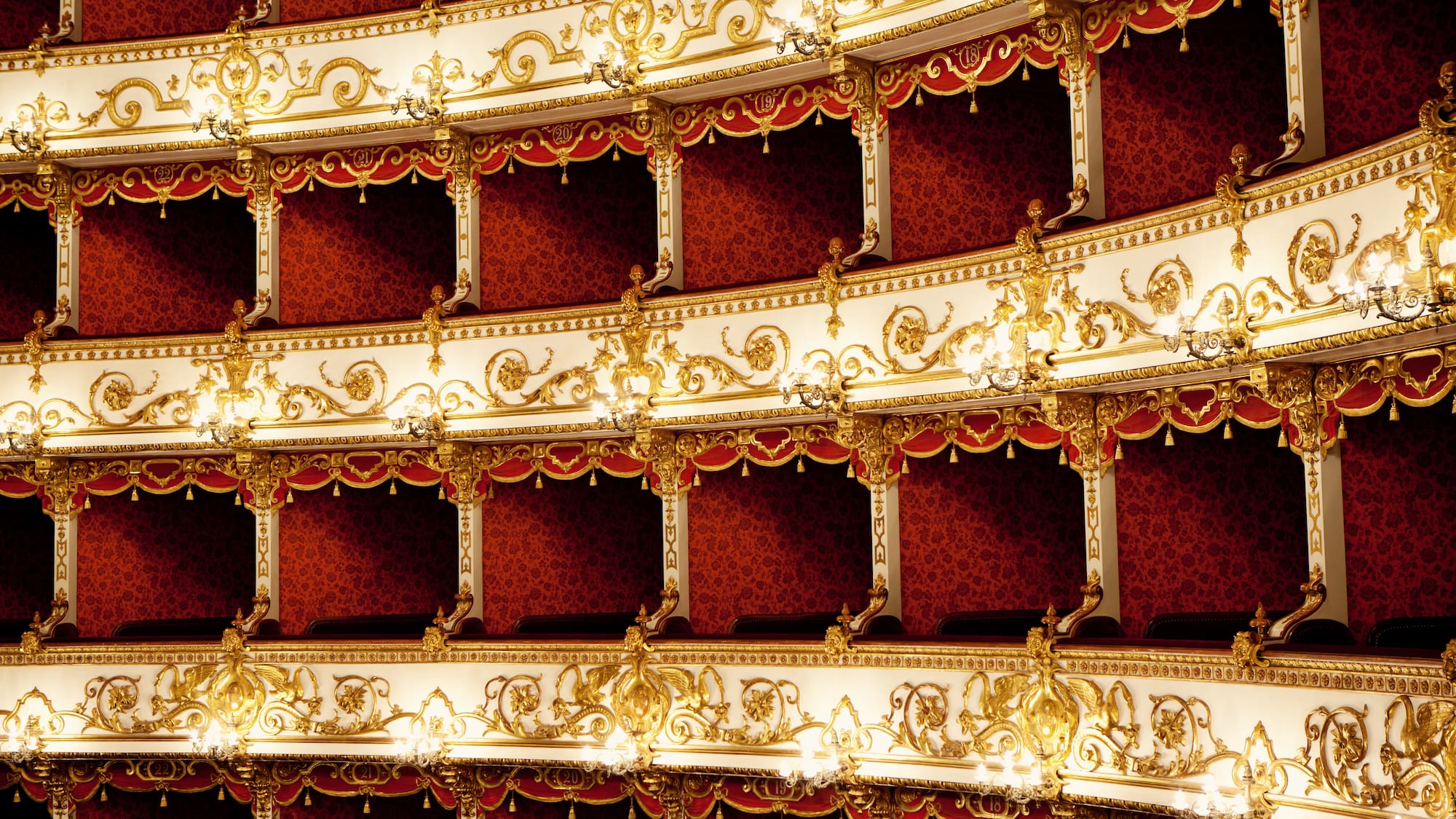 a red and white theater with gold designs