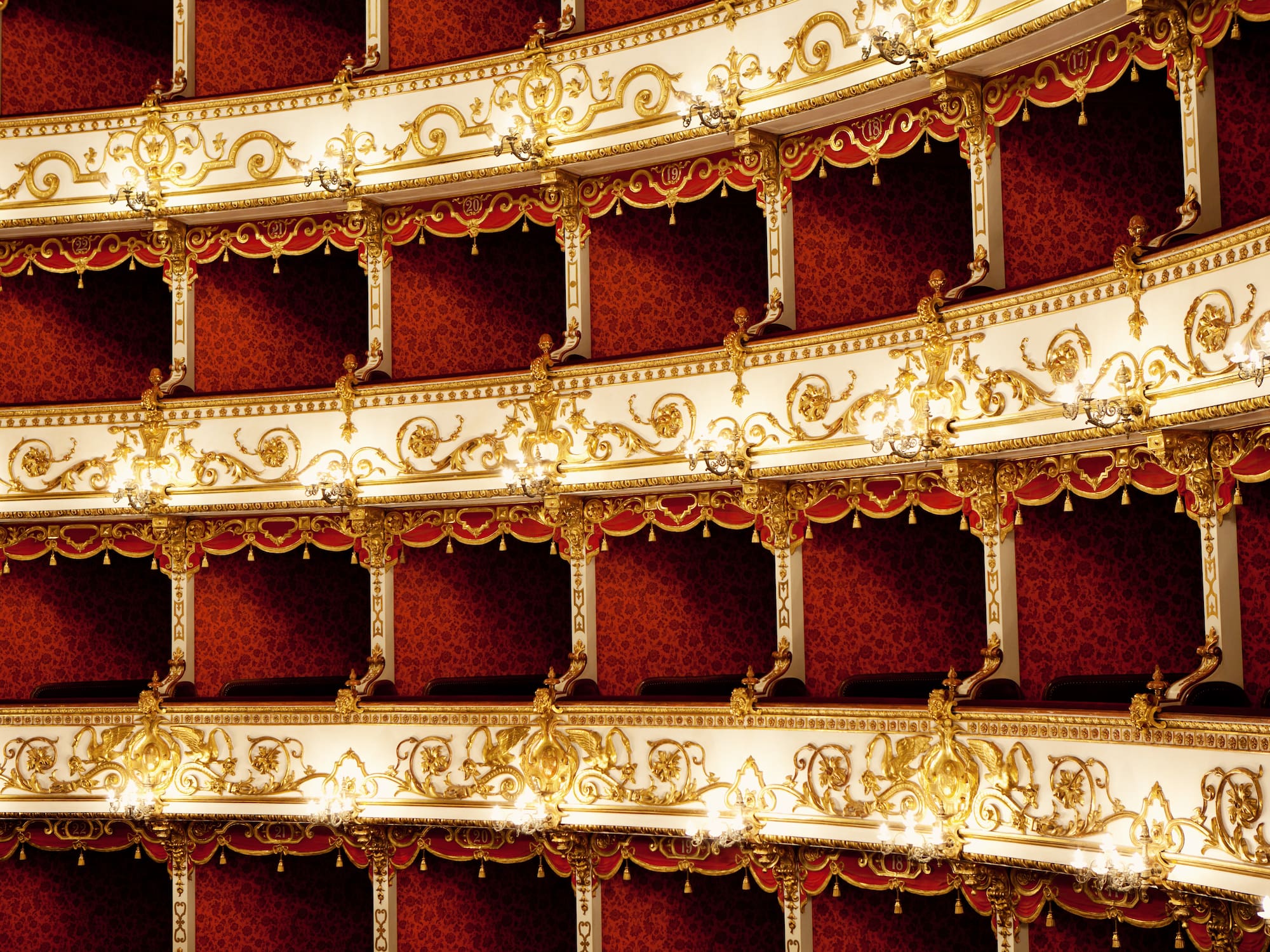 a red and white theater with gold designs