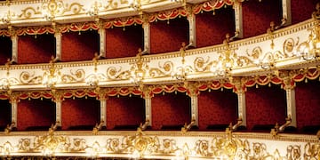 a red and white theater with gold designs