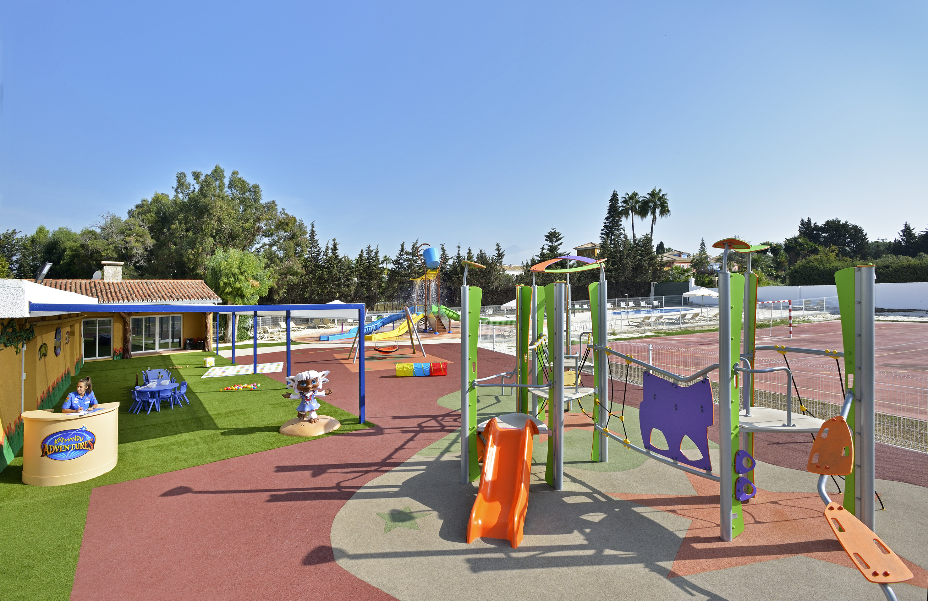 Resort playground with slides, water play, and Katmandu Adventures kids area.