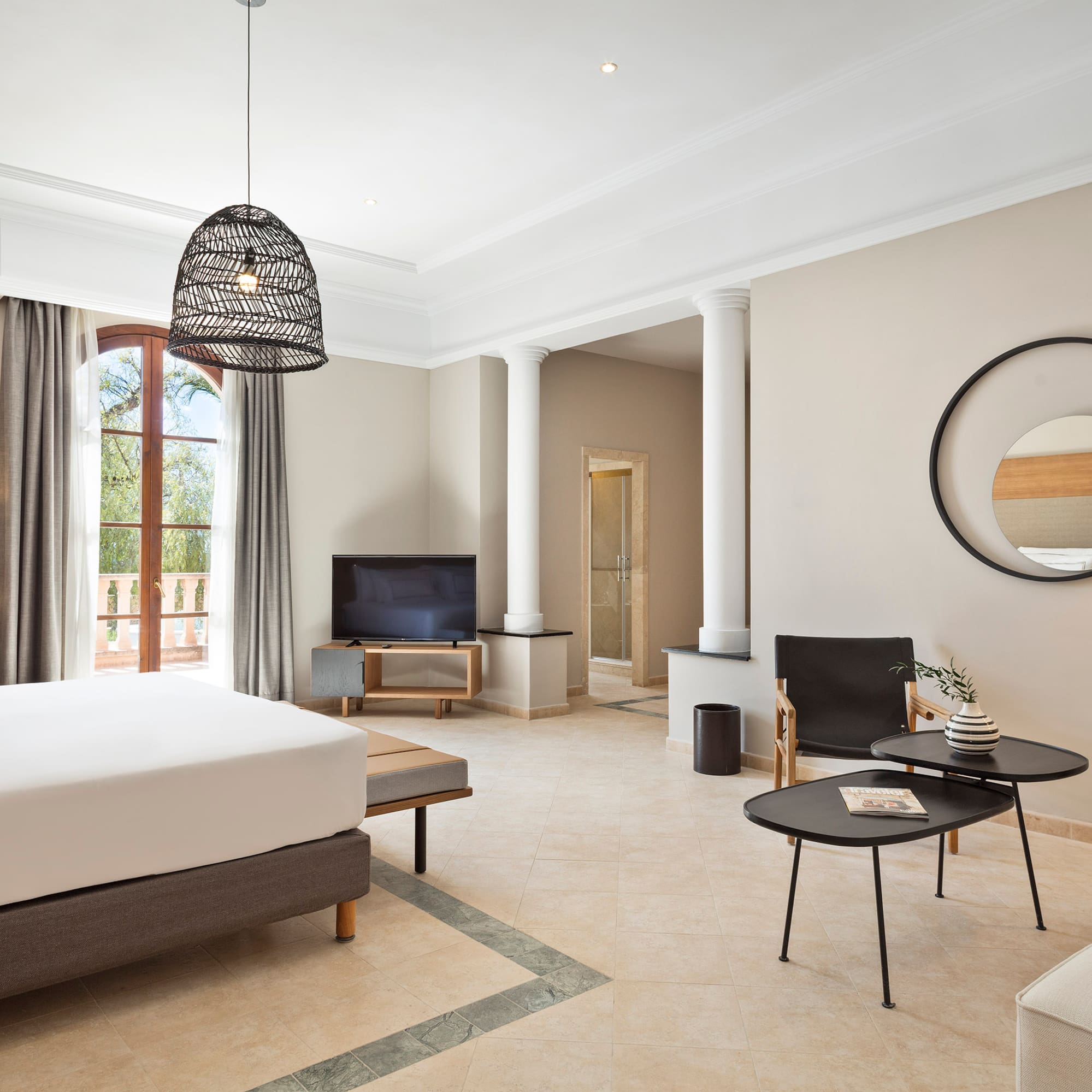 a room with a bed and a television