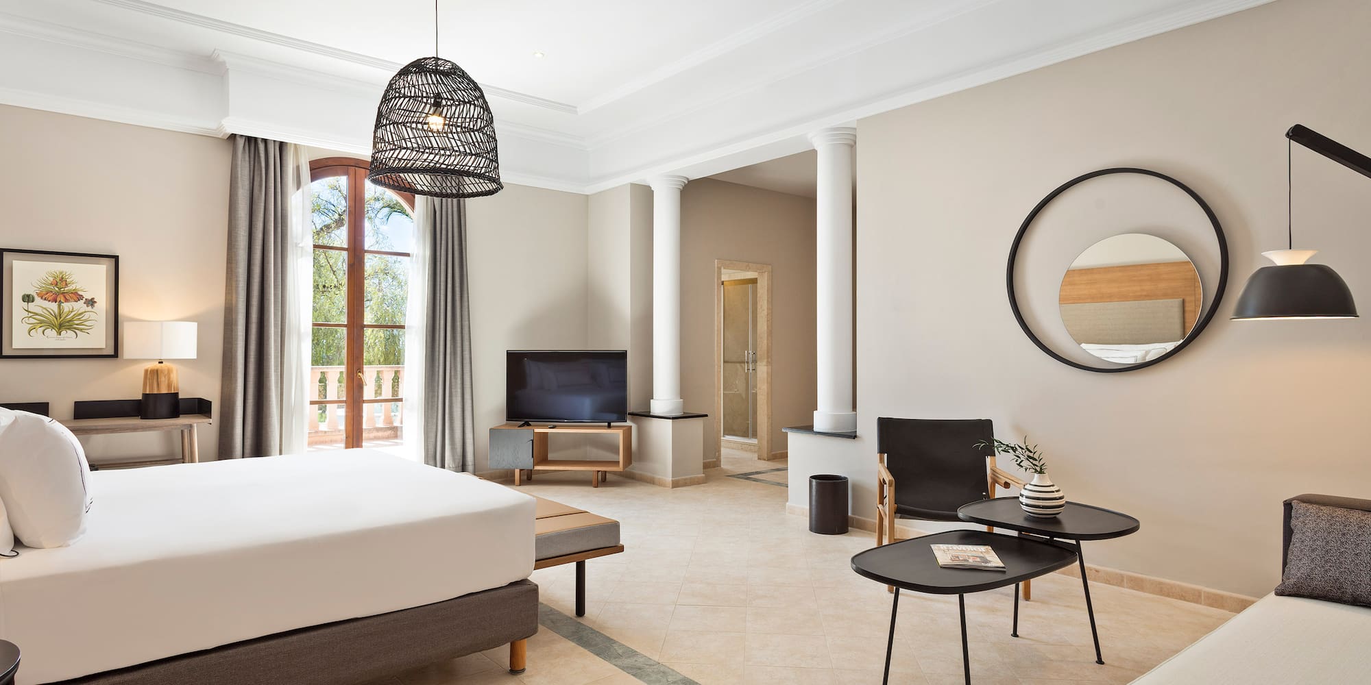 a room with a bed and a television