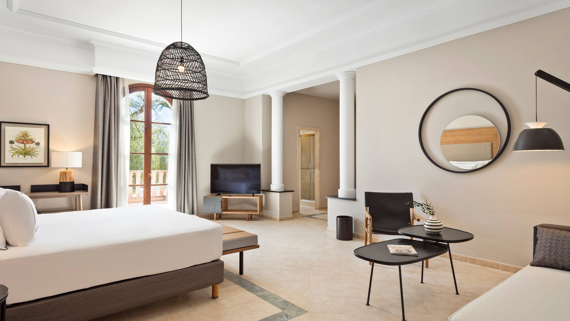 a room with a bed and a television