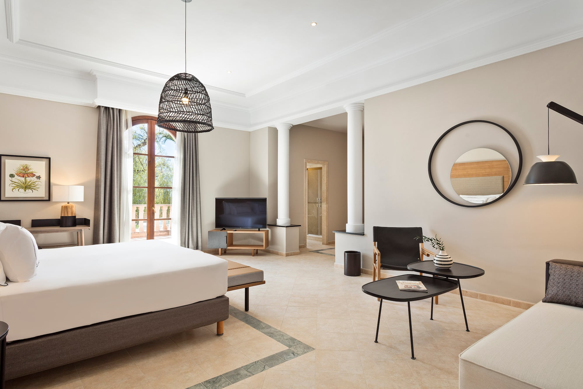 a room with a bed and a television