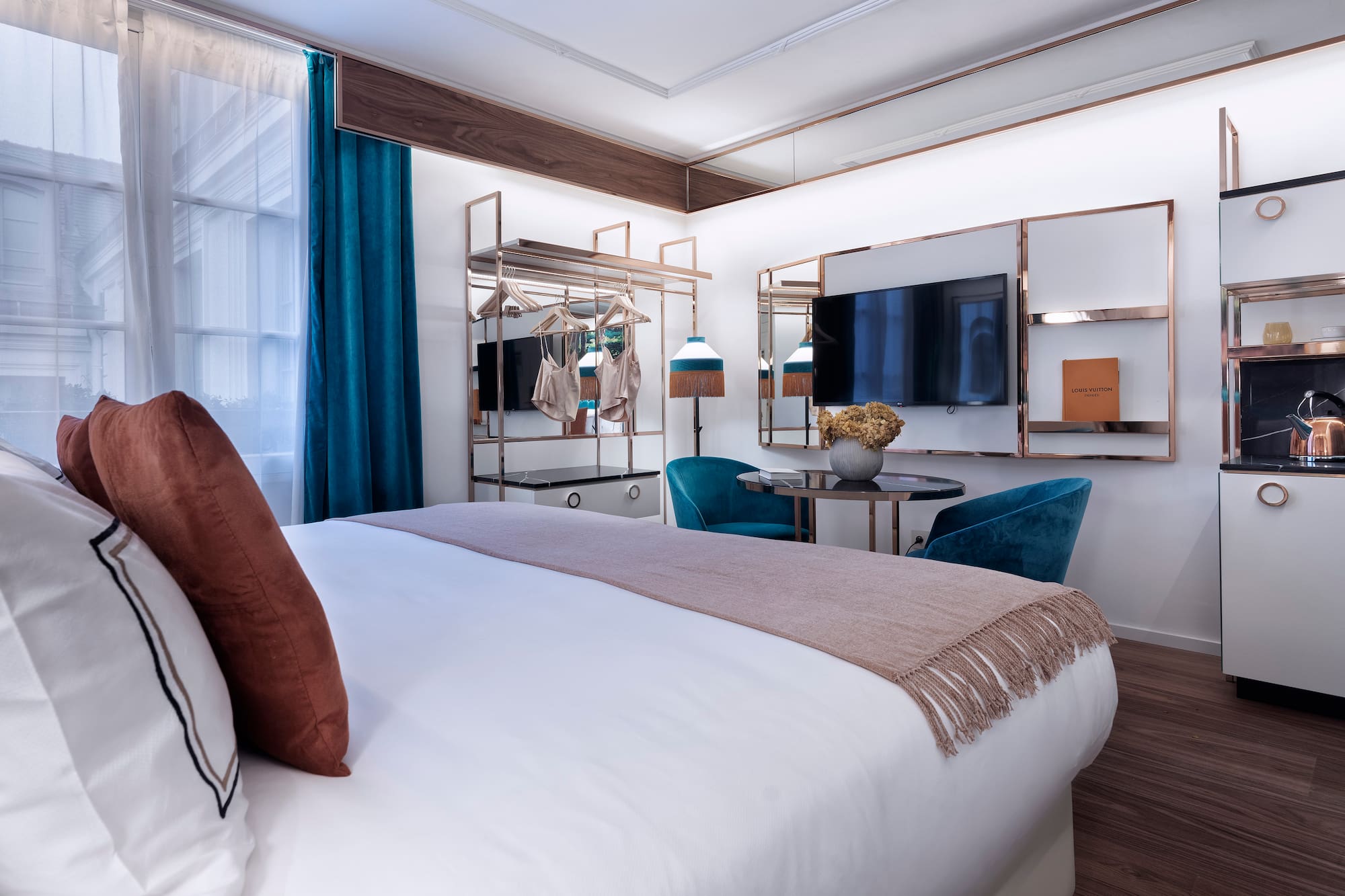 a bedroom with a bed and a table