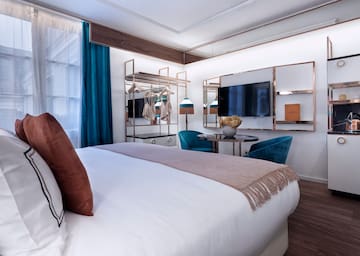 a bedroom with a bed and a table