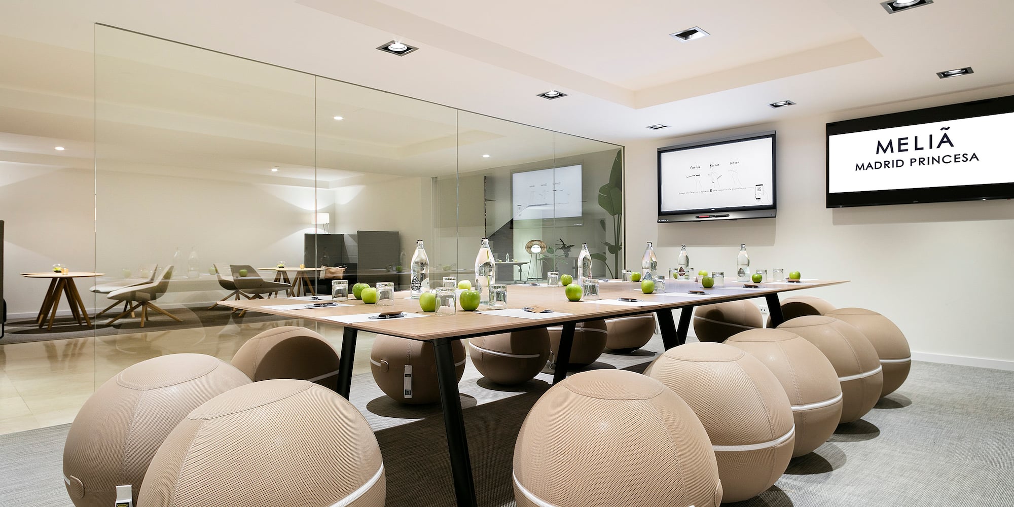 a conference room with a table and chairs