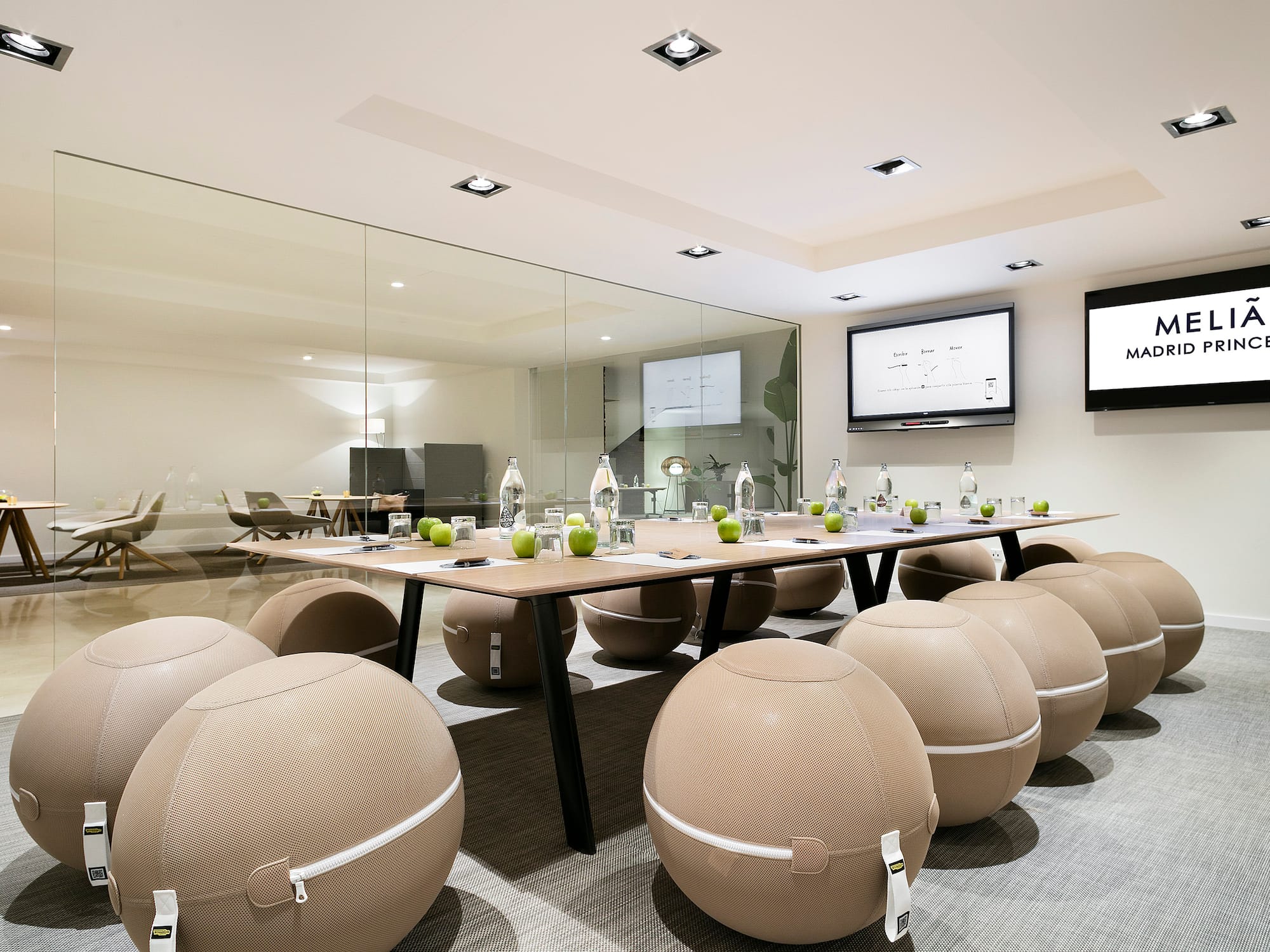 a conference room with a table and chairs