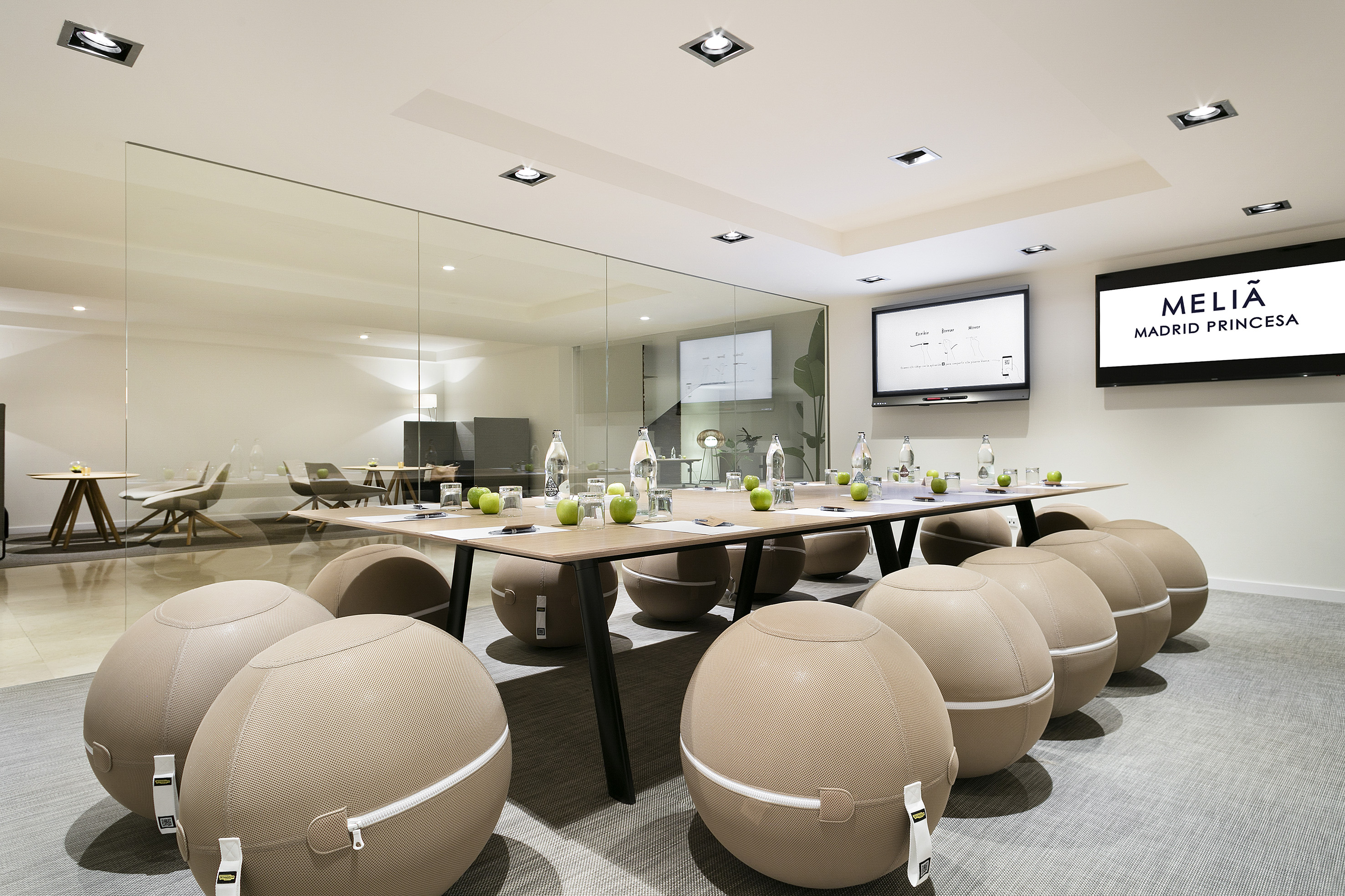 a conference room with a table and chairs