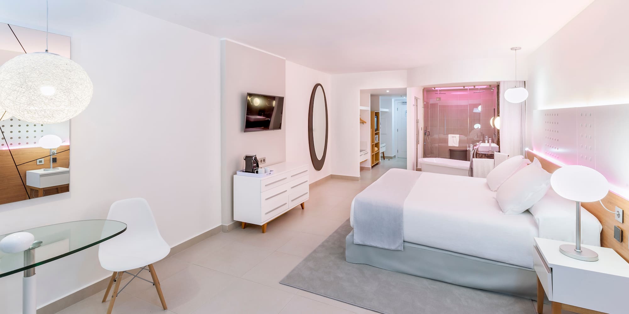 a bedroom with a bed and a table