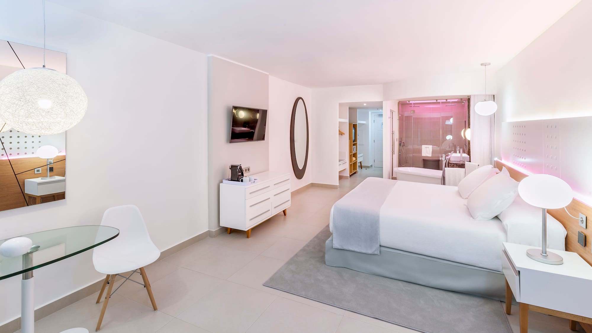 a bedroom with a bed and a table