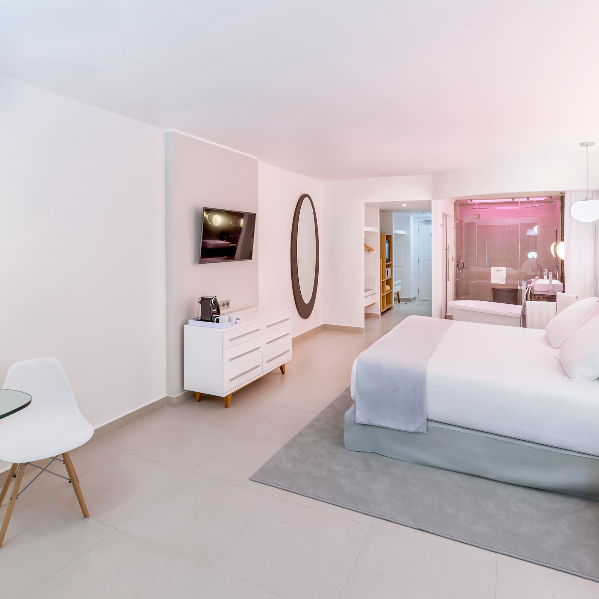 a bedroom with a bed and a table