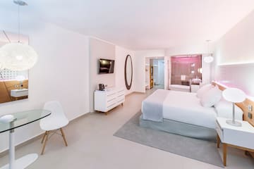 a bedroom with a bed and a table