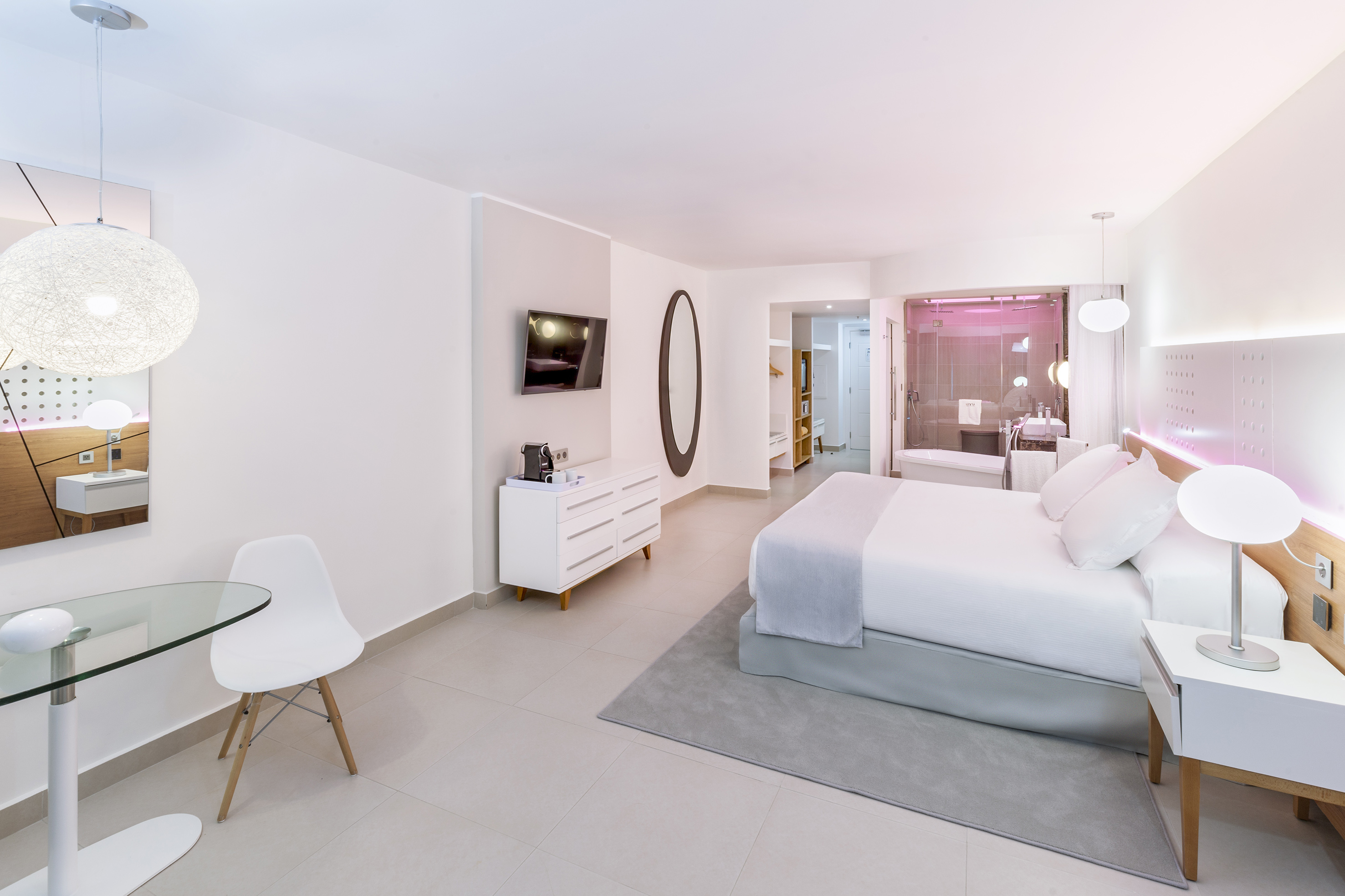 a bedroom with a bed and a table