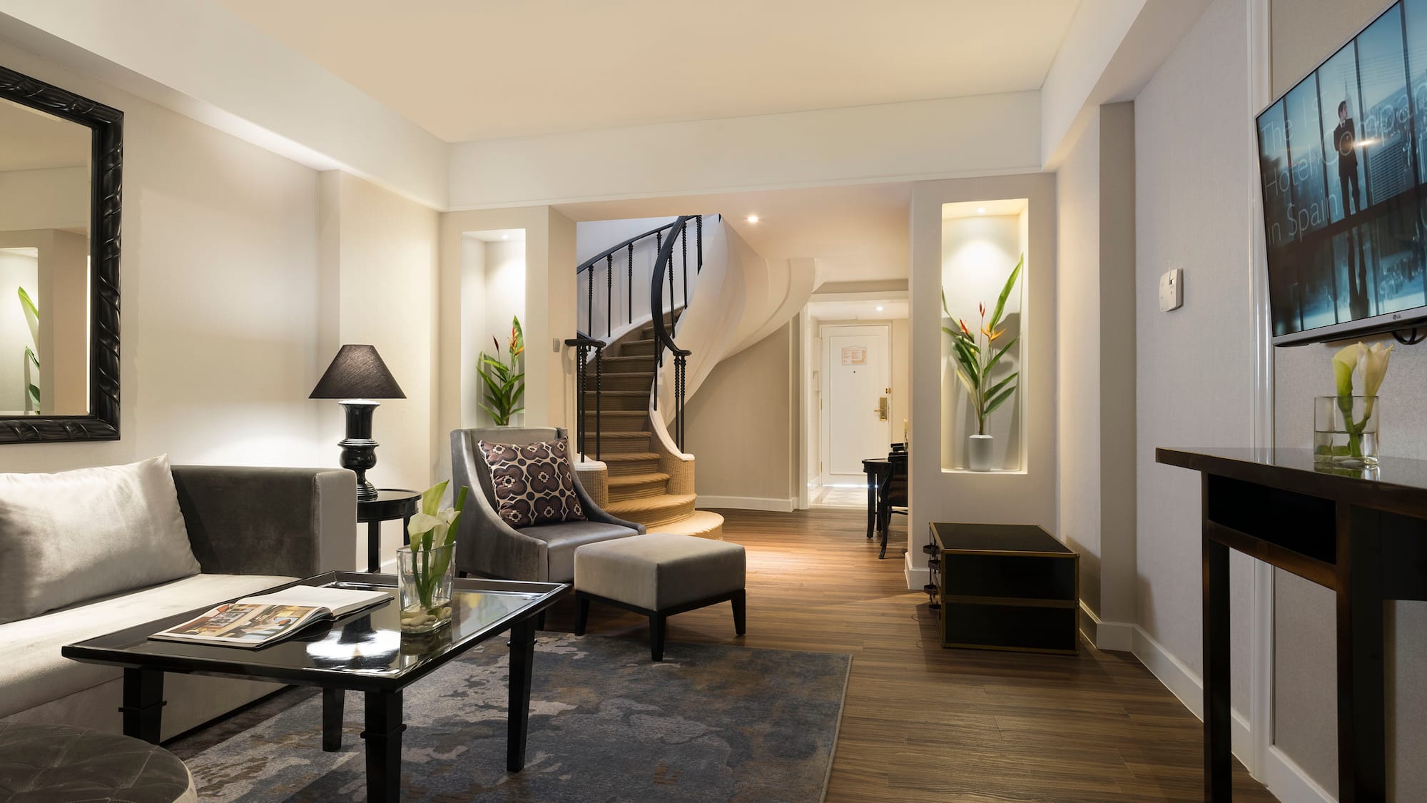 a living room with a spiral staircase