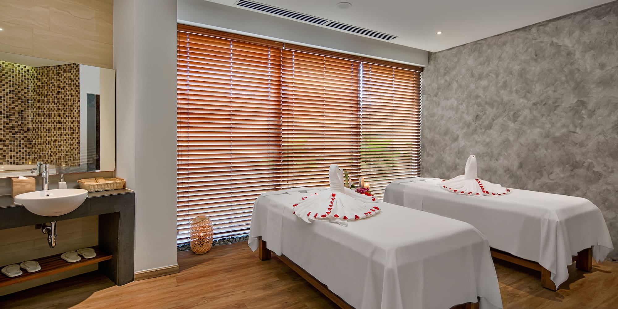 a room with beds and a fireplace