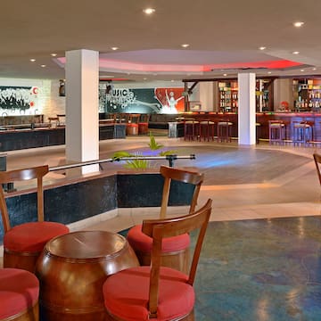 a room with chairs and tables