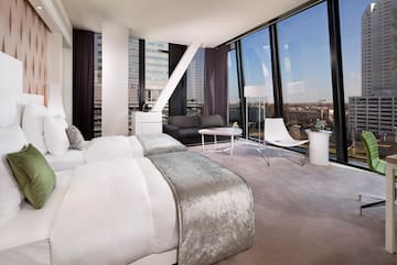 a room with two beds and a couch
