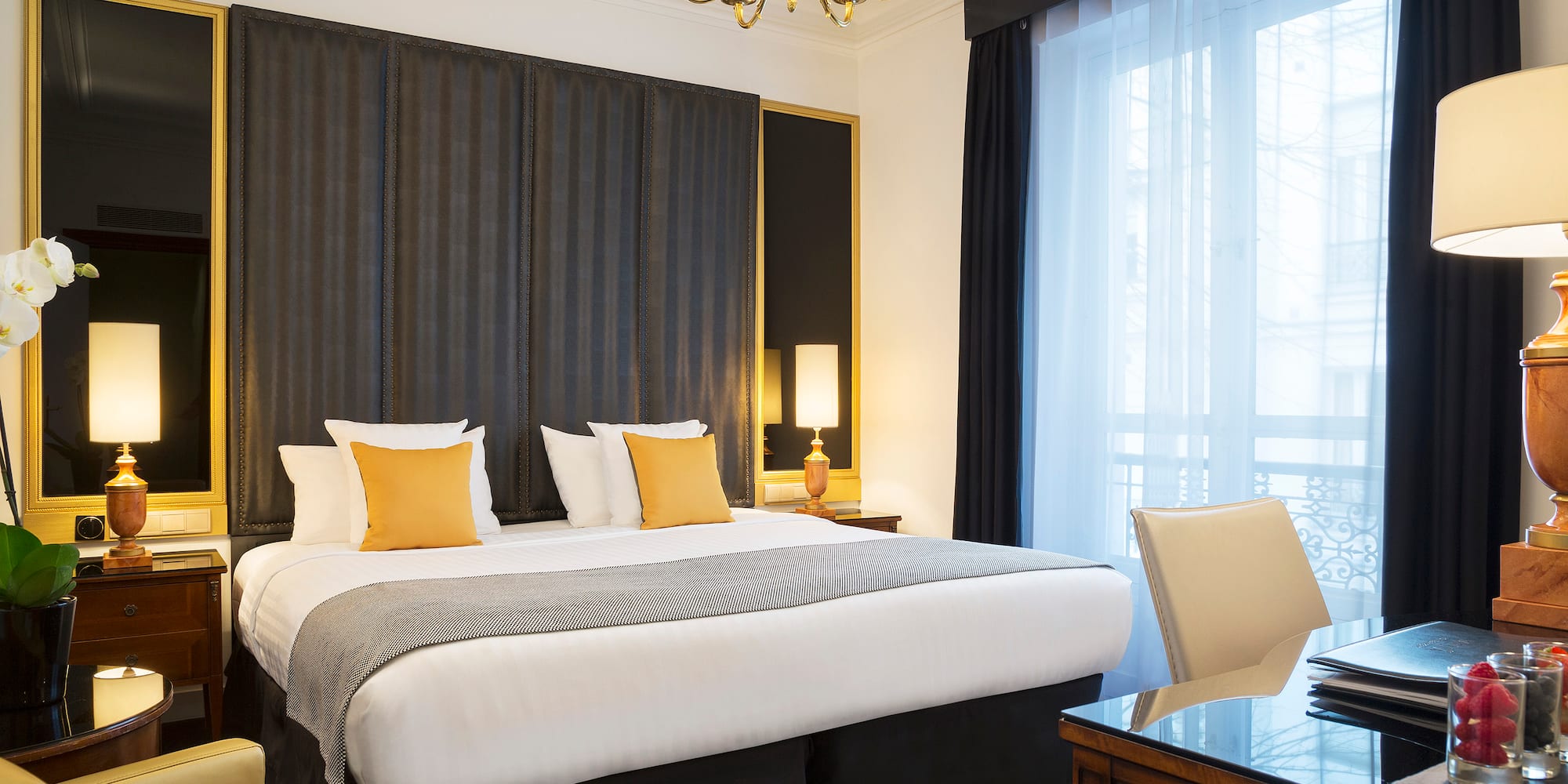 a room with a bed and a desk