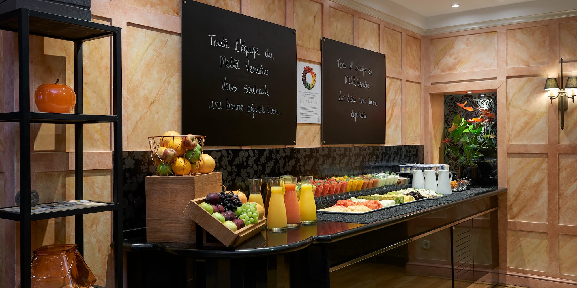 a buffet with fruit and juices
