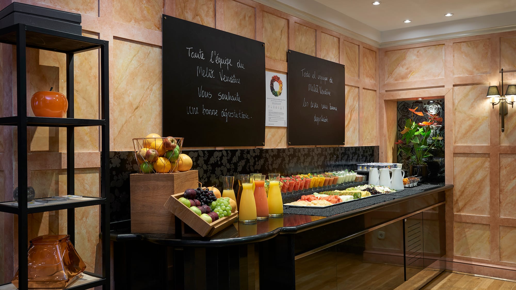 a buffet with fruit and juices