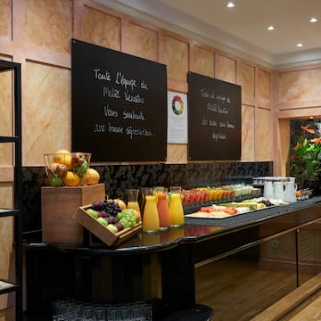 a buffet with fruit and juices