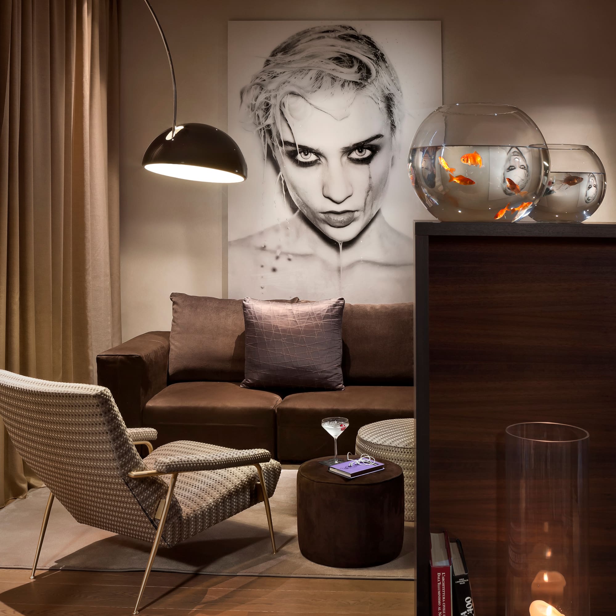 a living room with a couch and fish bowl