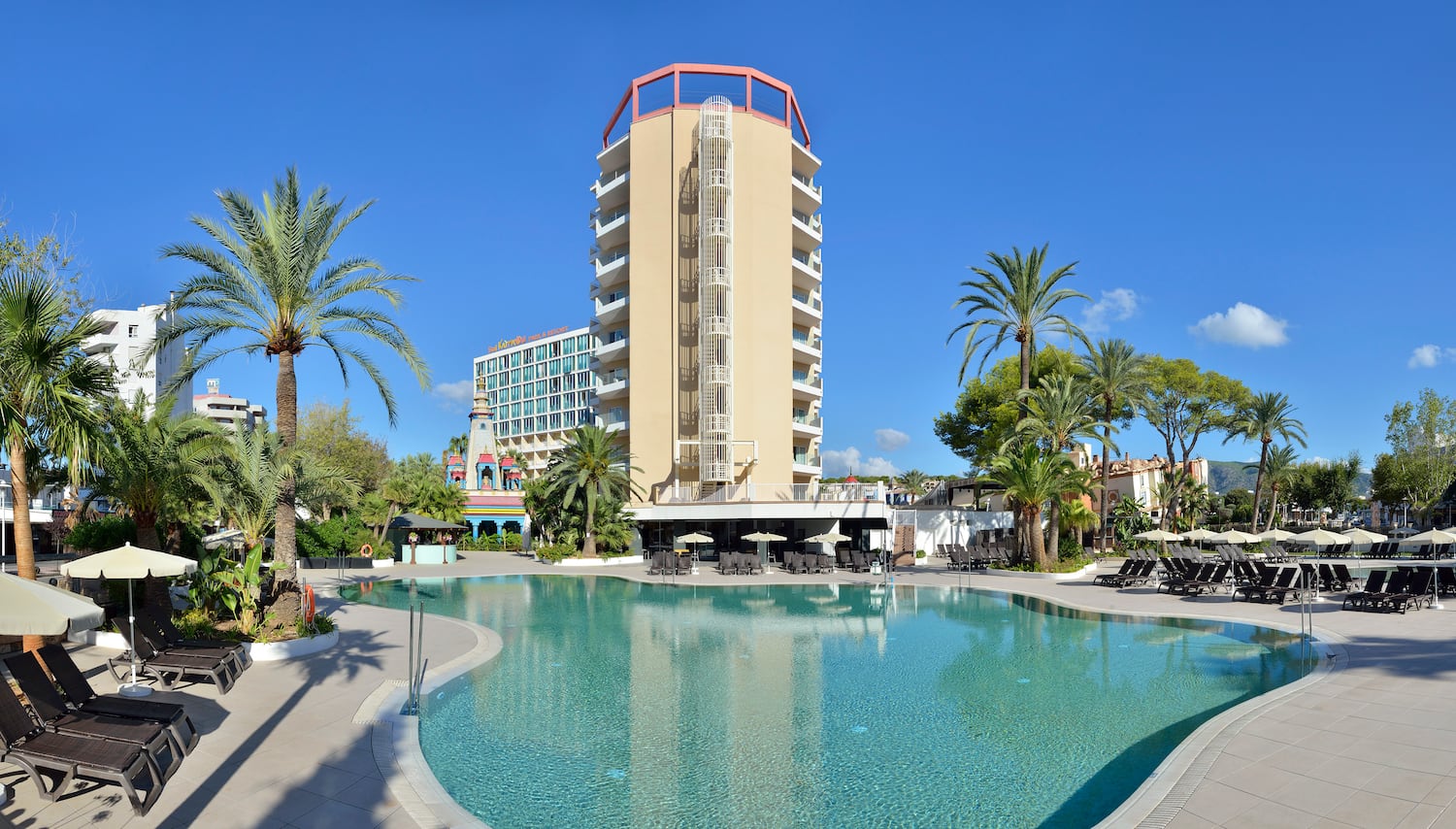 a pool with a building in the background